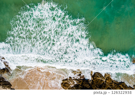 Aerial view Waves crashing on sandy shore,Sea surface in summer day background,Seascape top view waves texture background Aerial view Waves crashing on sandy shore,Sea surface in summer day background,Seascape top view waves texture background 126322938
