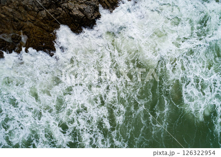 Aerial view Waves crashing on sandy shore,Sea surface in summer day background,Seascape top view waves texture background Aerial view Waves crashing on sandy shore,Sea surface in summer day background,Seascape top view waves texture background 126322954