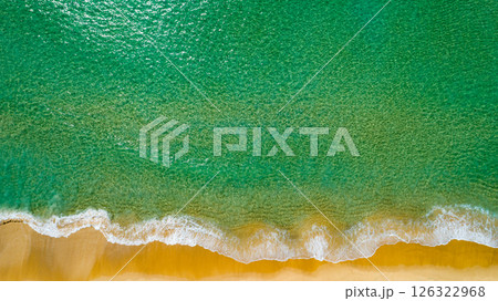 Aerial view Waves crashing on sandy shore,Sea surface in summer day background,Seascape top view waves texture background 126322968