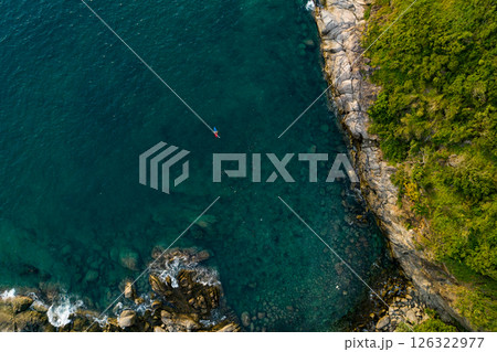 Aerial view Top down seashore, Waves crashing on rocks cliff, Beautiful sea surface in sunny day summer background, Amazing seascape top view seacoast at Phuket Thailand Aerial view Top down seashore, Waves crashing on rocks cliff, Beautiful sea surface in sunny day summer background, Amazing seascape top view seacoast at Phuket Thailand 126322977