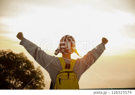 Man traveler with camera backpack hiking outdoor travel lifestyle and adventure concept. cap backpack and join of tourist for green mountain tour, beauty of nature and expansive sky people of tourism Man traveler with camera backpack hiking outdoor travel lifestyle and adventure concept. cap backpack and join of tourist for green mountain tour, beauty of nature and expansive sky people of tourism 126323574