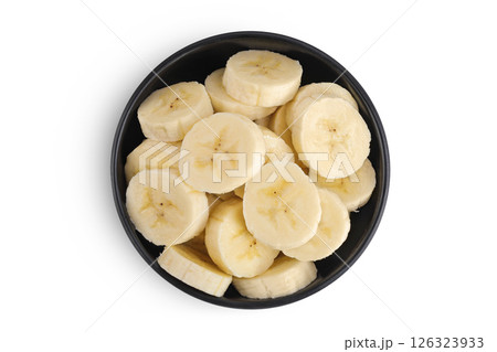 peeled banana pieces in ceramic bowl isolated on white background. Top view. Flat lay. peeled banana pieces in ceramic bowl isolated on white background. Top view. Flat lay. 126323933