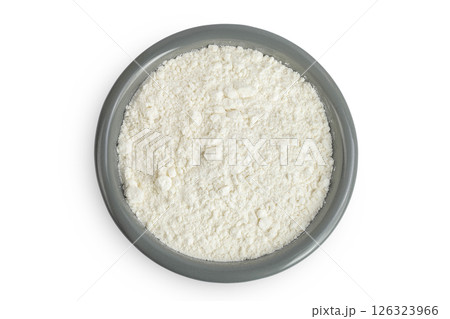 White flour in ceramic bowl isolated on white background. Top view. Flat lay. White flour in ceramic bowl isolated on white background. Top view. Flat lay. 126323966