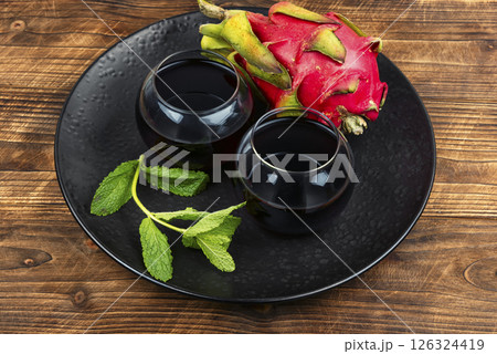 A glass of dragon fruit juice. A glass of dragon fruit juice. 126324419