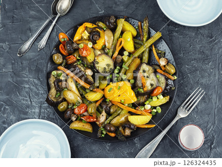 Roasted hot vegetables on a plate. 126324435