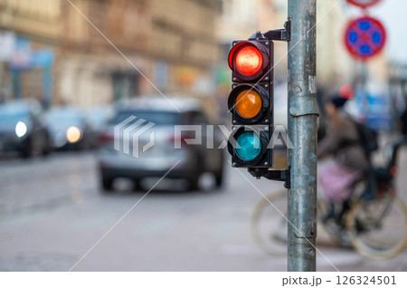 traffic light on the street junction with beautiful bokeh, city with cars in the background traffic light on the street junction with beautiful bokeh, city with cars in the background 126324501