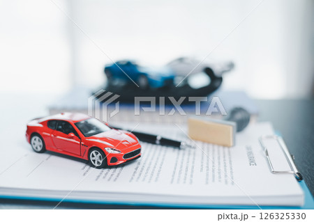 Approved car loan application with car key, rubber stamp and calculator concept. financial document on wooden table. Asset approval purchases to buy car. Ideas for car buying checklist loan tax Approved car loan application with car key, rubber stamp and calculator concept. financial document on wooden table. Asset approval purchases to buy car. Ideas for car buying checklist loan tax 126325330