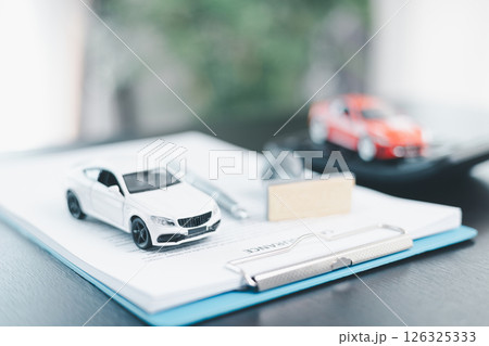 Approved car loan application with car key, rubber stamp and calculator concept. financial document on wooden table. Asset approval purchases to buy car. Ideas for car buying checklist loan tax Approved car loan application with car key, rubber stamp and calculator concept. financial document on wooden table. Asset approval purchases to buy car. Ideas for car buying checklist loan tax 126325333