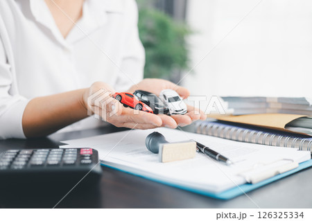 Businesswoman hand stamp approve on financial business approval document paper. Man hand accept permit contract agreement. Broker manager sign contract bank guarantee approved stamp application form 126325334