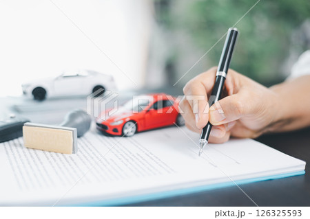 Businesswoman hand stamp approve on financial business approval document paper. Man hand accept permit contract agreement. Broker manager sign contract bank guarantee approved stamp application form 126325593