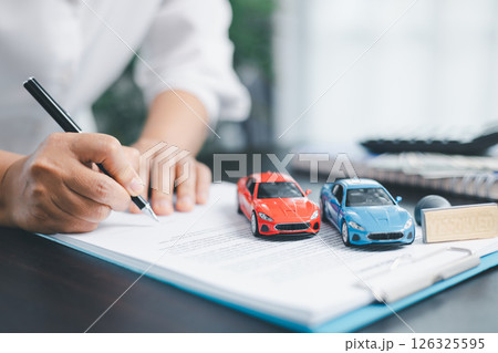 Businesswoman hand stamp approve on financial business approval document paper. Man hand accept permit contract agreement. Broker manager sign contract bank guarantee approved stamp application form Businesswoman hand stamp approve on financial business approval document paper. Man hand accept permit contract agreement. Broker manager sign contract bank guarantee approved stamp application form 126325595