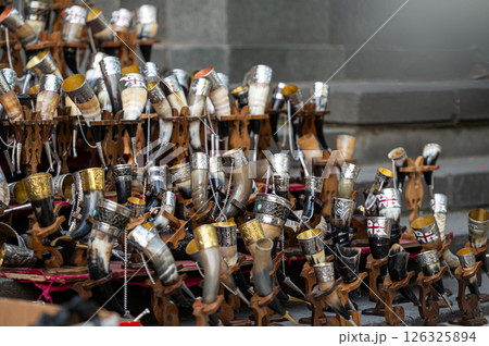 Collection of Ornate Drinking Horns on Display at a Local Artisan Market in Autumn Collection of Ornate Drinking Horns on Display at a Local Artisan Market in Autumn 126325894