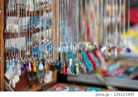 Colorful Handmade Jewelry Displayed at Artisan Market Stall During Sunny Afternoon 126325895