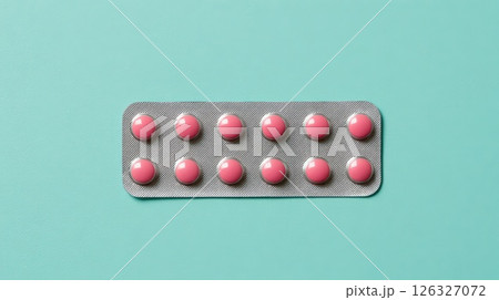 Pink Pills in a Blister Pack on a Light Aqua Background Pink Pills in a Blister Pack on a Light Aqua Background 126327072