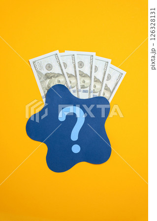 Dollar bills behind blue spot. Concept of dirty money or its unclear origin. Legalization of money, money laundering. Financial transparency, illegal transactions. Financial investigations. 126328131