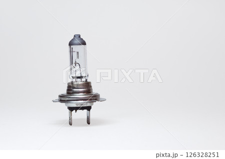 halogen low beam lamp for car headlights. spare parts. include clipping path for easy isolation from background 126328251