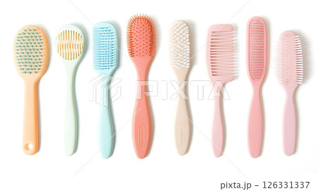 A row of six different colored hairbrushes 126331337