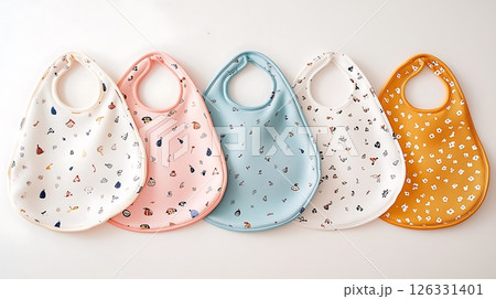 A row of baby bibs with different colors and patterns 126331401