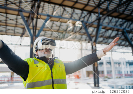 Engineer using virtual reality to inspect building progress. Engineer using virtual reality to inspect building progress. 126332083