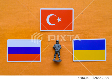 Flags of Russia, Ukraine and Turkey on a yellow background. The Russian-Ukrainian conflict. 126332099