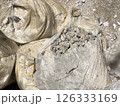 Gravel and Construction Debris Packed in Transparent Bags at Worksite Under Sunlight Gravel and Construction Debris Packed in Transparent Bags at Worksite Under Sunlight 126333169