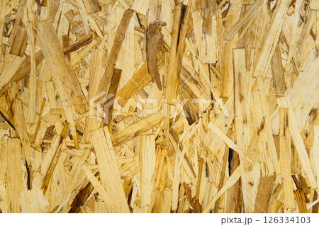 Abstract OSB texture with wood chips closeup for template, backdrop or web design. Natural background element for construction themes Abstract OSB texture with wood chips closeup for template, backdrop or web design. Natural background element for construction themes 126334103
