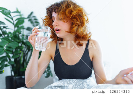 morning headache woman hangover 126334316