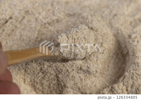 natural wheat flour with bran, fresh wheat flour close-up, flour for making bread with bran, , flour with a wooden spoon natural wheat flour with bran, fresh wheat flour close-up, flour for making bread with bran, , flour with a wooden spoon 126334805