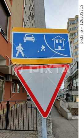 Warning Sign for Pedestrians and Vehicles Present in an Urban Setting for Safety Warning Sign for Pedestrians and Vehicles Present in an Urban Setting for Safety 126335515