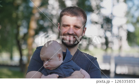Joyful father portrait with a small child in a summer park 126335855