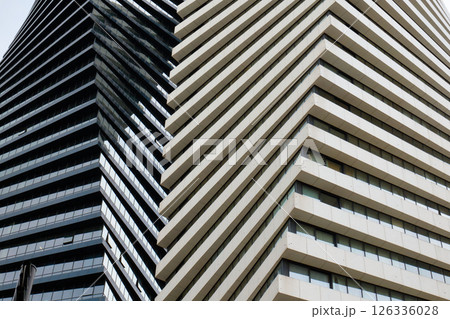 Two contrasting skyscrapers showcase distinct architectural styles downtown Two contrasting skyscrapers showcase distinct architectural styles downtown 126336028