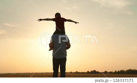 silhouette father carrying child boy his shoulders sunsethappy family, father carrying child, child on shoulders, sunset family time, parent child bonding, outdoor family fun, silhouette father son 126337171