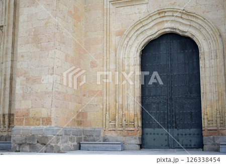 View of a large front door of a Gothic cathedral in Segovia. View of a large front door of a Gothic cathedral in Segovia. 126338454