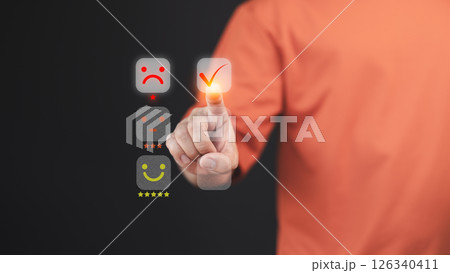 Customer hand touch a digital rating interface, selecting a one-star rating with a sad face icon. This concept illustrates customer dissatisfaction, feedback, and the importance of user experience. 126340411