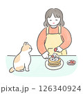 パンケーキを作る女の子と見守る猫 126340924