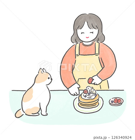 パンケーキを作る女の子と見守る猫 126340924