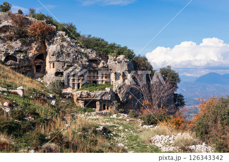 Acropolis, carved in rock tombs of ancient Greek city Tlos in Lycia located on Lycian way Famous historical and archeological site. Popular place for family travel on summer vacation. Fethiye, Mugla, Acropolis, carved in rock tombs of ancient Greek city Tlos in Lycia located on Lycian way Famous historical and archeological site. Popular place for family travel on summer vacation. Fethiye, Mugla, 126343342