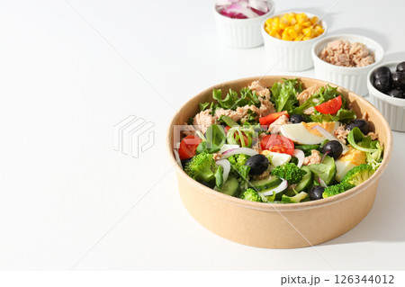 Tuna salad in a cardboard plate on a light table. Tuna salad in a cardboard plate on a light table. 126344012
