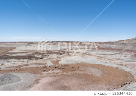 Eroded Desert Landscape at Petrified Forest National Park Under Clear Blue Sky Eroded Desert Landscape at Petrified Forest National Park Under Clear Blue Sky 126344410