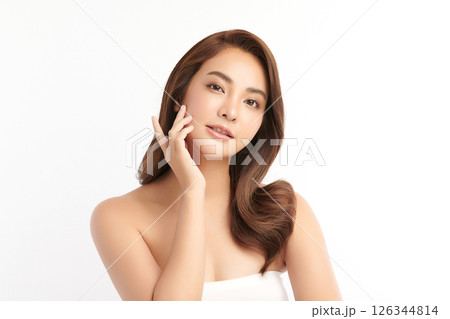 A beautiful young Asian woman with clean, fresh skin against a white background. Skincare, facial treatment, cosmetology, beauty, and spa. An elegant portrait of an Asian woman. A beautiful young Asian woman with clean, fresh skin against a white background. Skincare, facial treatment, cosmetology, beauty, and spa. An elegant portrait of an Asian woman. 126344814