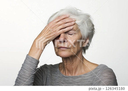 Closeup portrait of depressed elderly woman touching head in despair on isolated background. stress concepts. 126345180