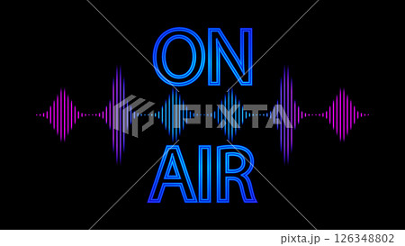 An illuminated ON AIR sign with a glowing red dot and colorful soundwave graphic on a black background, indicating a live broadcast 126348802