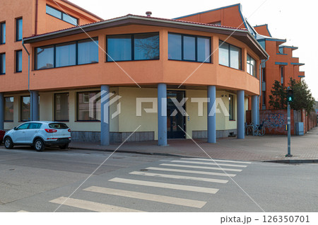 Modern building at a crosswalk in an urban area during the day 126350701