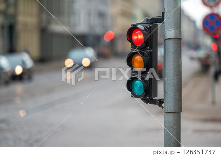 traffic light on the street junction with beautiful bokeh, city with cars in the background traffic light on the street junction with beautiful bokeh, city with cars in the background 126351737