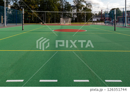 New multi-sport court opened at local park featuring basketball and tennis facilities 126351744