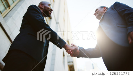 Below, business people or men in city, handshake or partnership with B2B deal. Low angle, employees or outdoor with introduction, onboarding or welcome with greeting, hello or agreement with contract 126351772