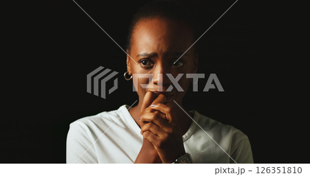 Thinking, anxiety and sad woman biting nails in studio for fear, stress and mental health on background. Pensive, nervous and black person worrying for trauma, crisis and depression with nyctophobia 126351810