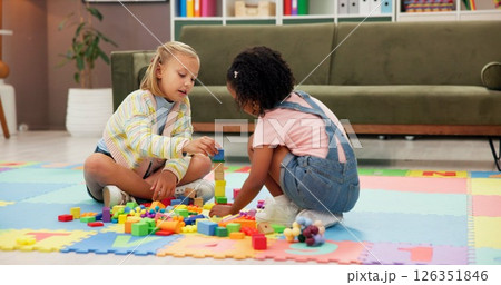 Building blocks, fun and children in psychology waiting room with cognitive development or growth. Friends, creative and girl kids playing with educational toys for sensory or motor skills at clinic. 126351846