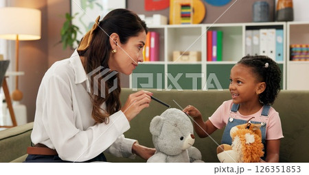 Therapist, child and toys in office for therapy session, mental health and learning. Psychologist woman, story and girl for evaluation, clinic or consultation for patient support or development 126351853