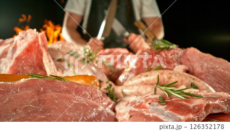 Fresh butcher cut meat assortment. Raw Various Kinds of Meat Served on a Table. Preparation of Meat. Isolated on Black Background. 126352178